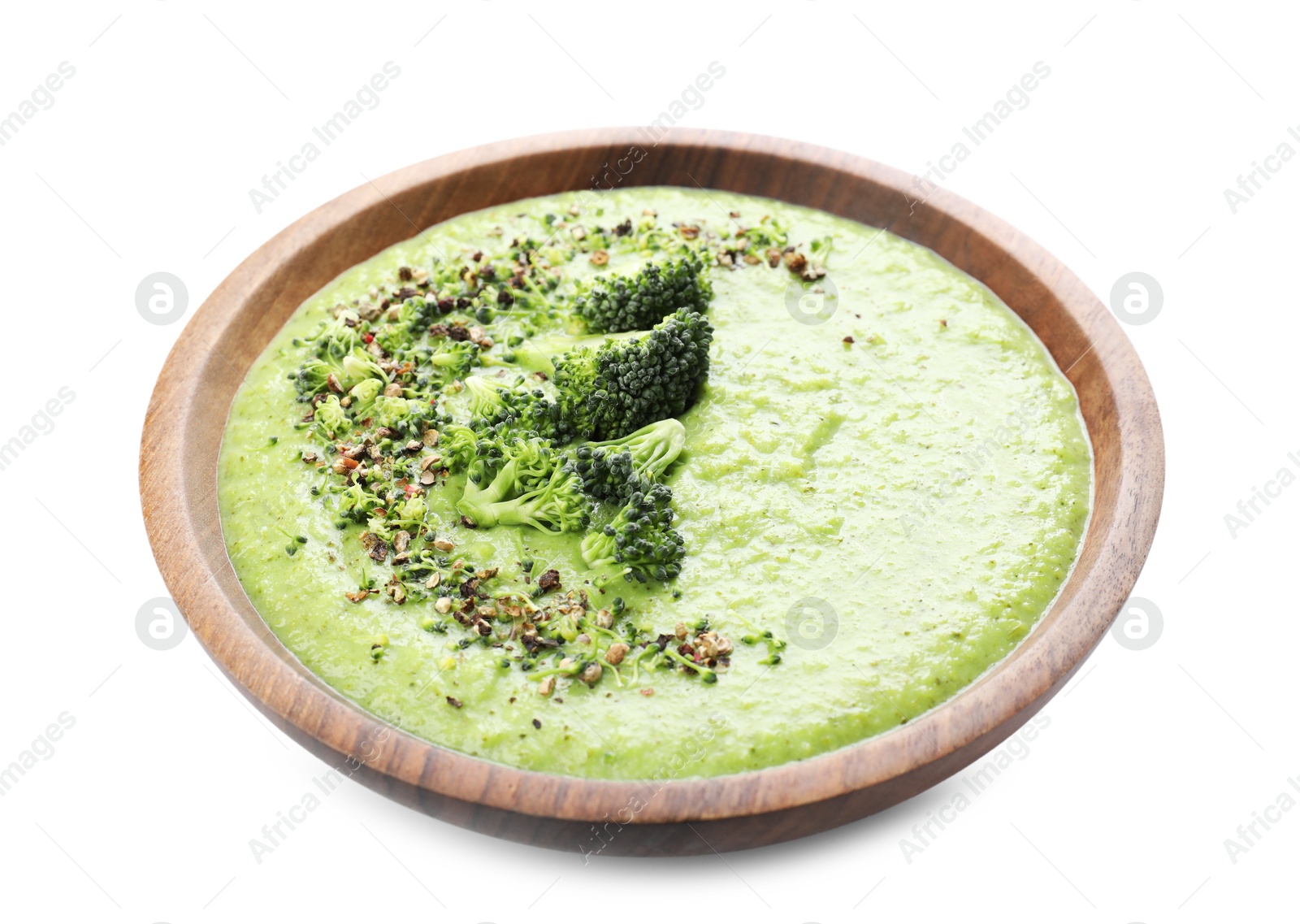 Photo of Delicious broccoli cream soup in bowl isolated on white