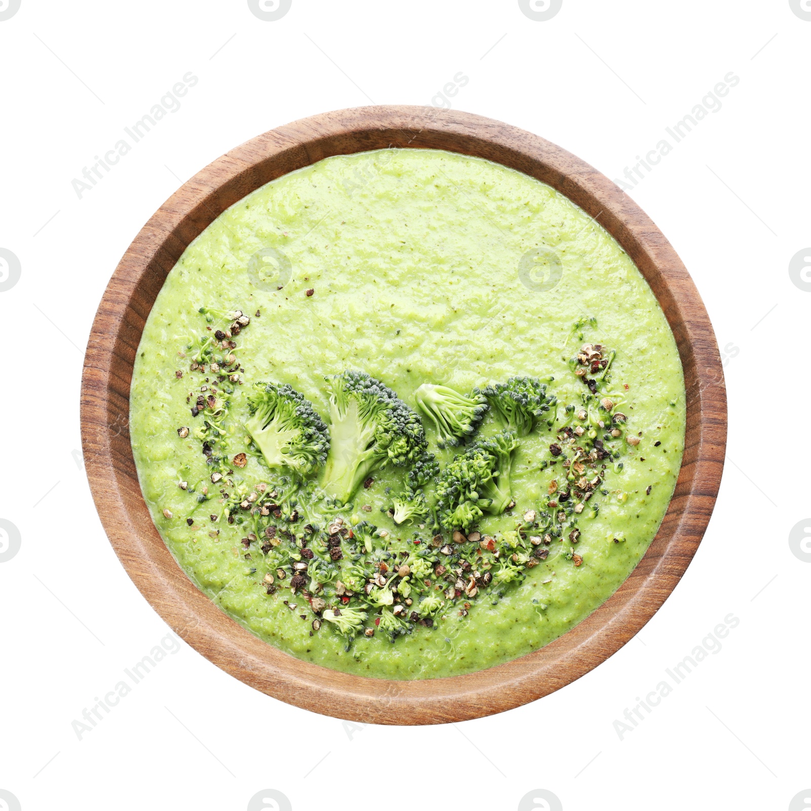 Photo of Delicious broccoli cream soup in bowl isolated on white, top view