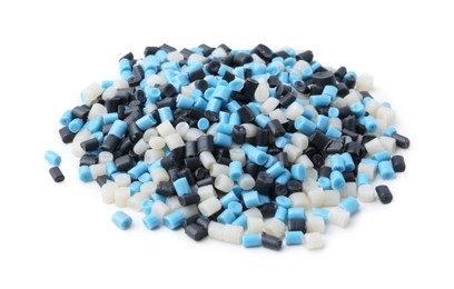 Photo of Pile of colorful plastic granules on white background