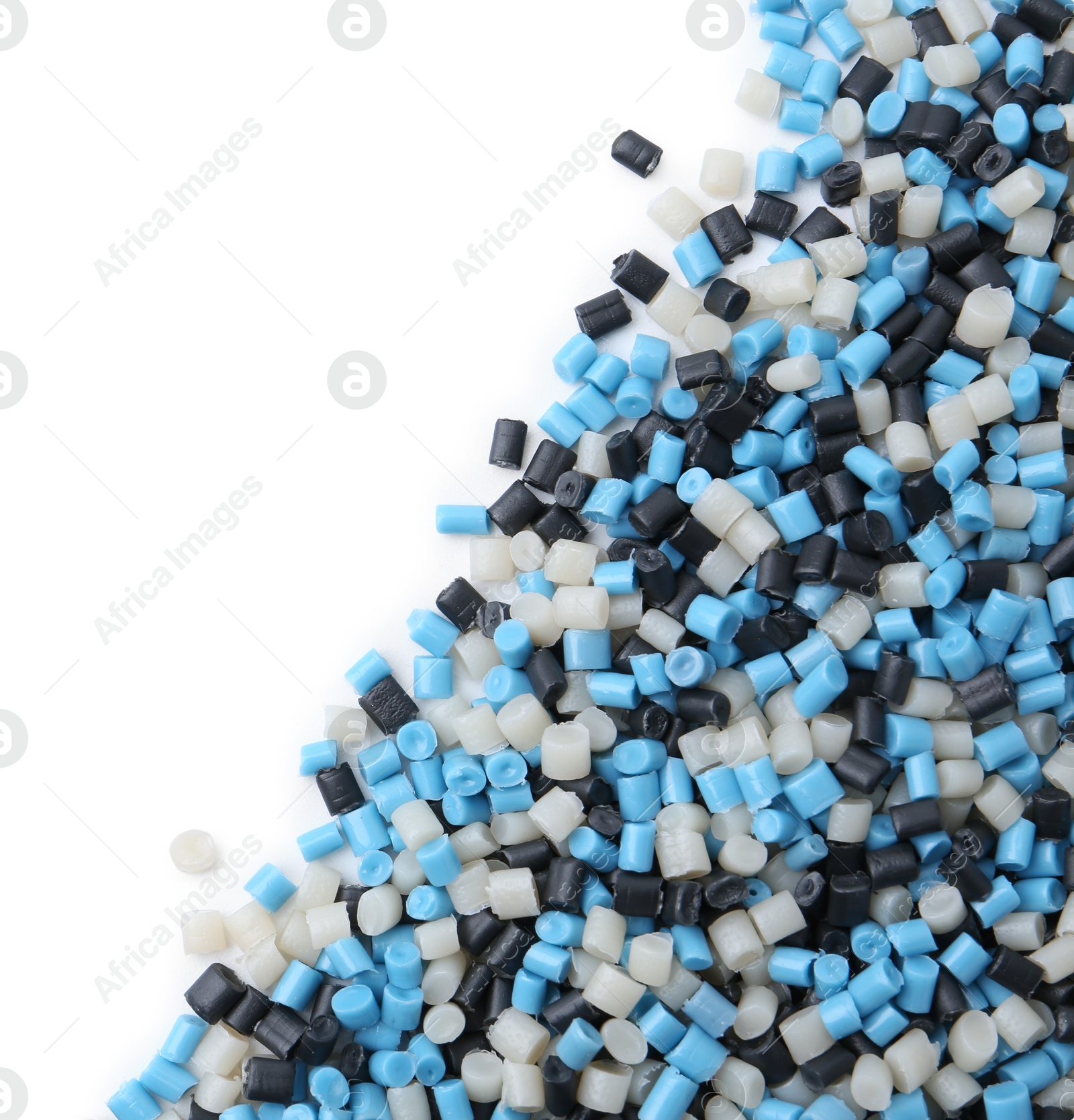 Photo of Pile of colorful plastic granules isolated on white, top view