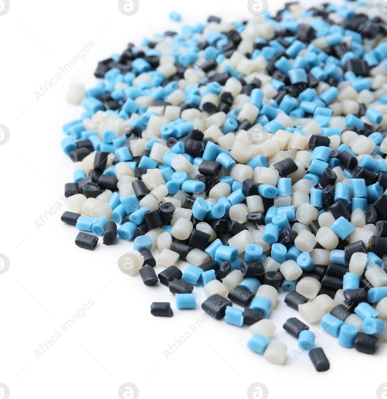 Photo of Pile of colorful plastic granules on white background