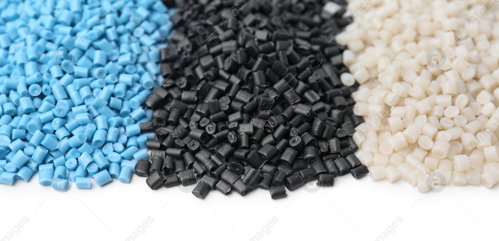 Photo of Pile of colorful plastic granules isolated on white, top view