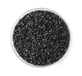 Photo of Black plastic granules in petri dish isolated on white, top view