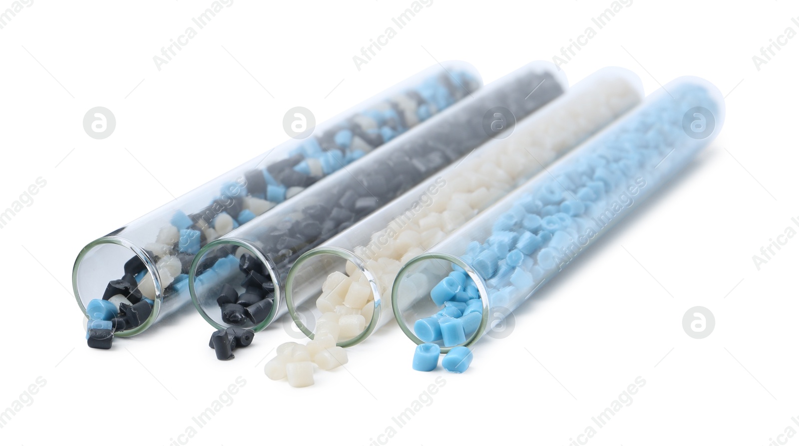 Photo of Colorful plastic granules in test tubes isolated on white