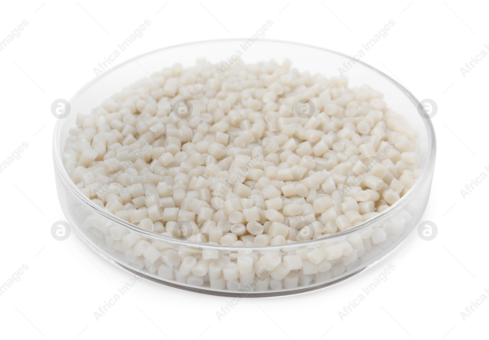 Photo of Plastic granules in petri dish isolated on white