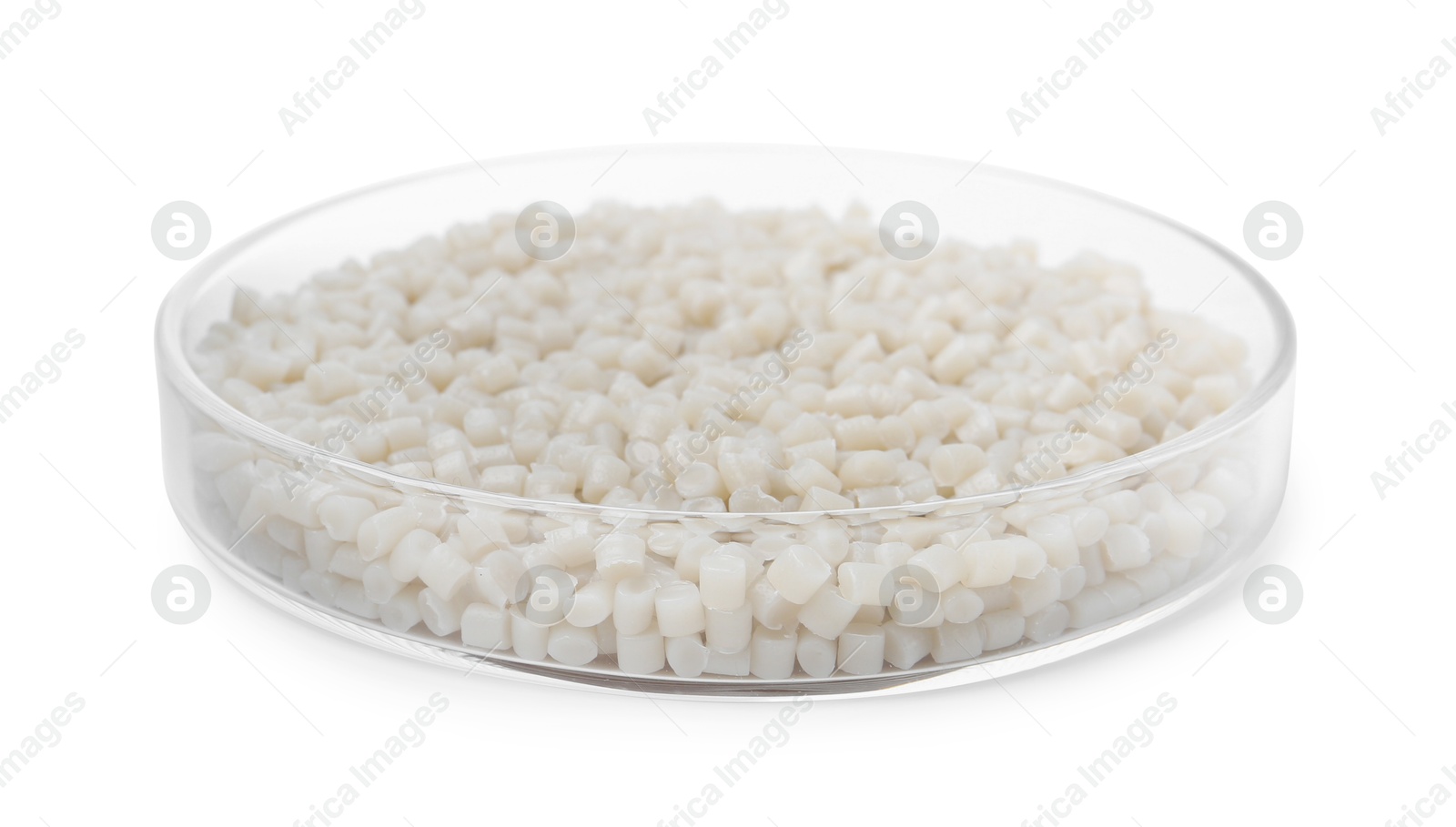 Photo of Plastic granules in petri dish isolated on white