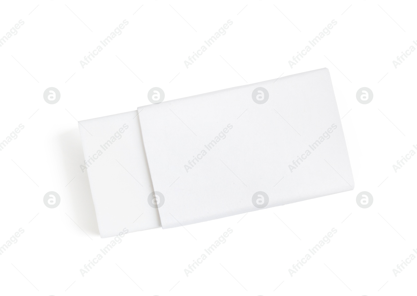 Photo of New eraser isolated on white, top view. School stationery