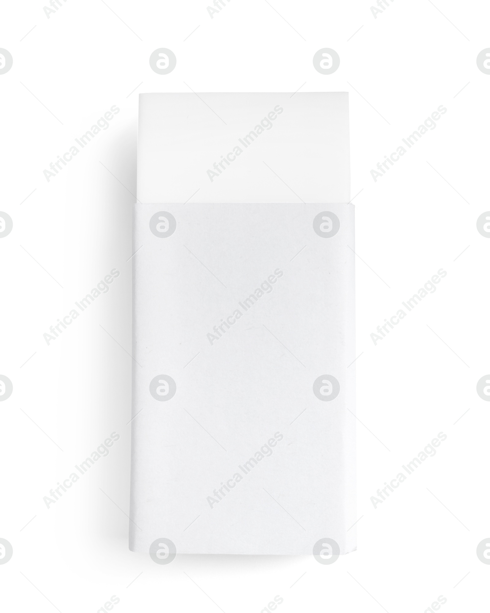 Photo of New eraser isolated on white, top view. School stationery