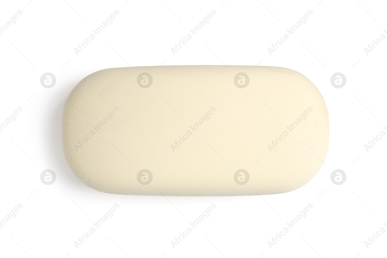 Photo of New eraser isolated on white, top view. School stationery