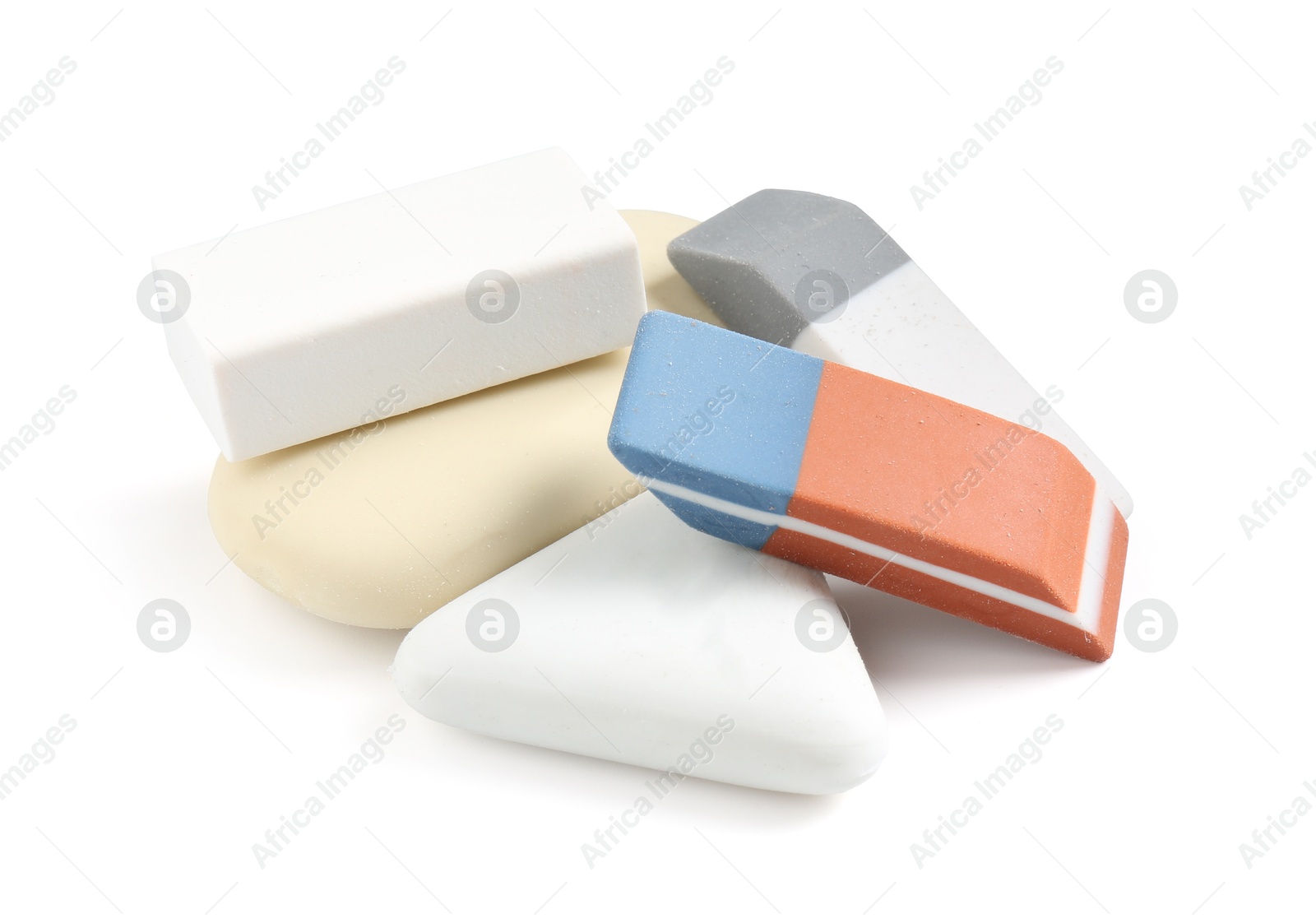 Photo of Different new erasers isolated on white. School stationery