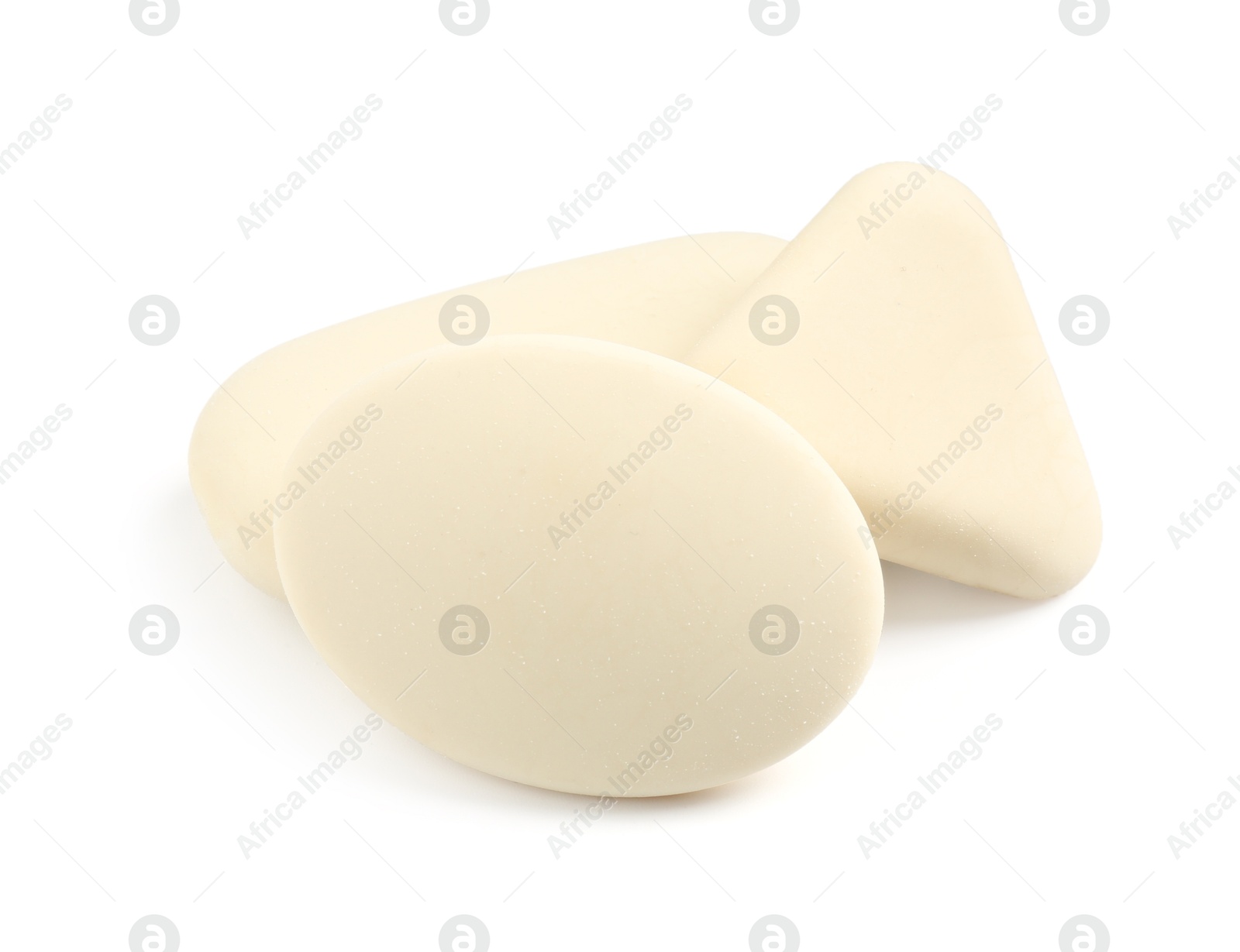 Photo of Different new erasers isolated on white. School stationery