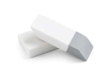 Photo of Two new erasers isolated on white. School stationery