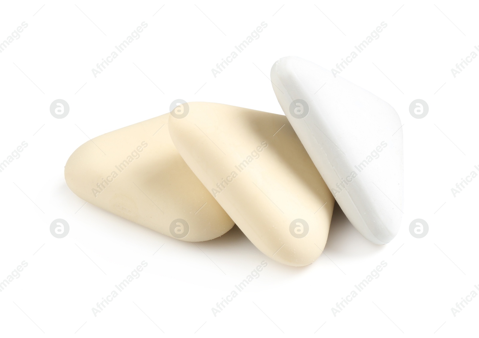 Photo of Different new erasers isolated on white. School stationery