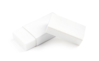 Photo of Two new erasers isolated on white. School stationery