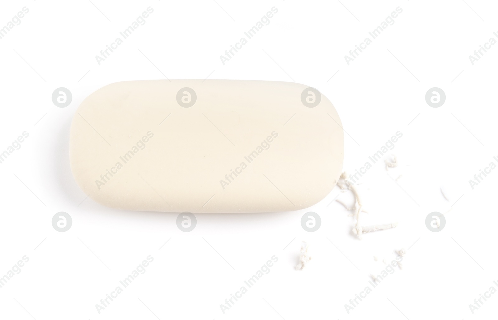 Photo of One eraser and scraps isolated on white, top view