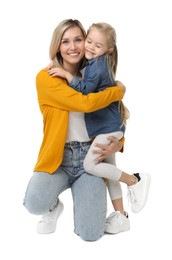 Happy mother with her cute little daughter on white background