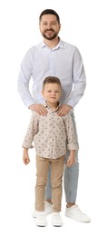 Happy father with his cute little son on white background