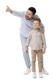 Photo of Happy father with his cute little son looking at something on white background