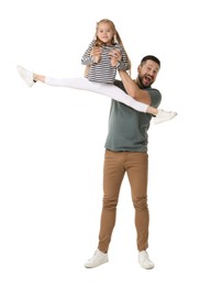 Happy father and his cute little daughter having fun on white background