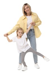 Happy mother and her cute little daughter on white background