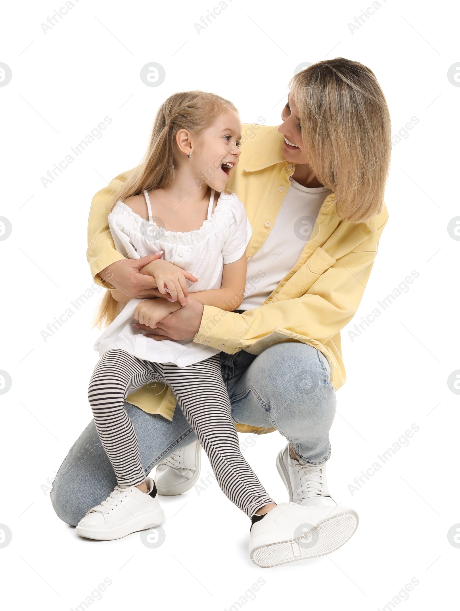 Photo of Happy mother and her cute little daughter on white background