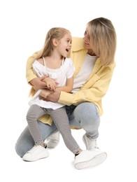 Photo of Happy mother and her cute little daughter on white background