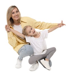 Happy mother and her cute little daughter on white background