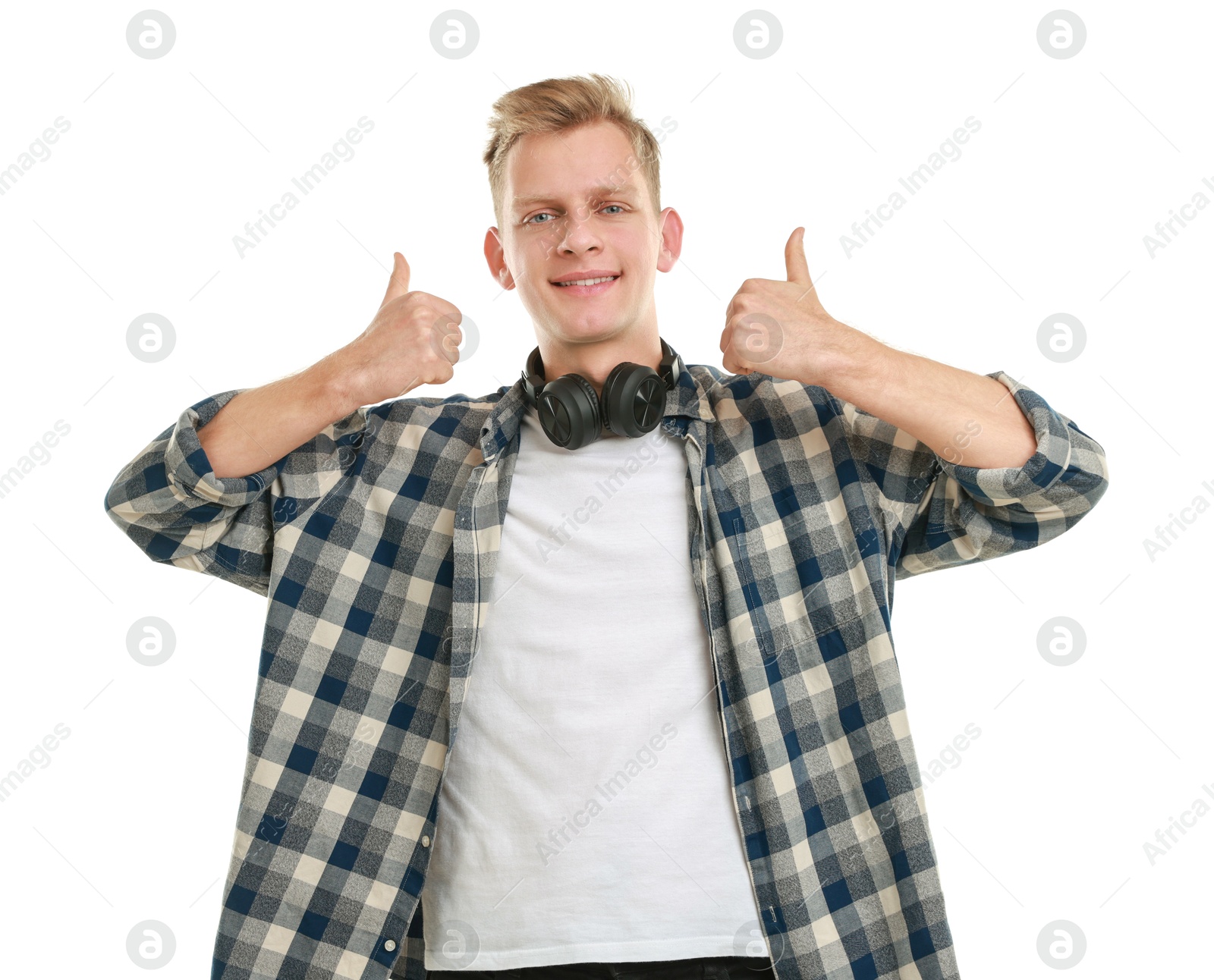 Photo of Happy man with headphones showing thumbs up on white background. Like gesture