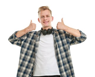 Happy man with headphones showing thumbs up on white background. Like gesture