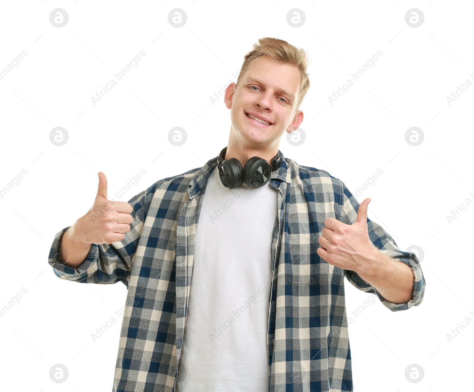 Photo of Happy man with headphones showing thumbs up on white background. Like gesture