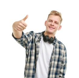 Photo of Happy man with headphones showing thumbs up on white background. Like gesture