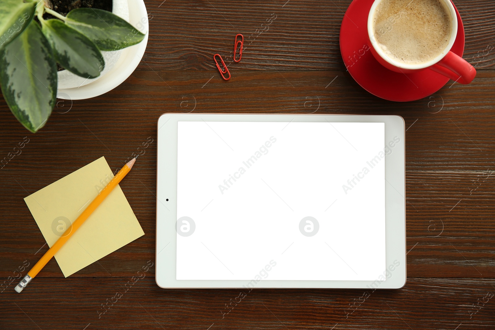 Photo of Flat lay composition with blank tablet on wooden table, space for text