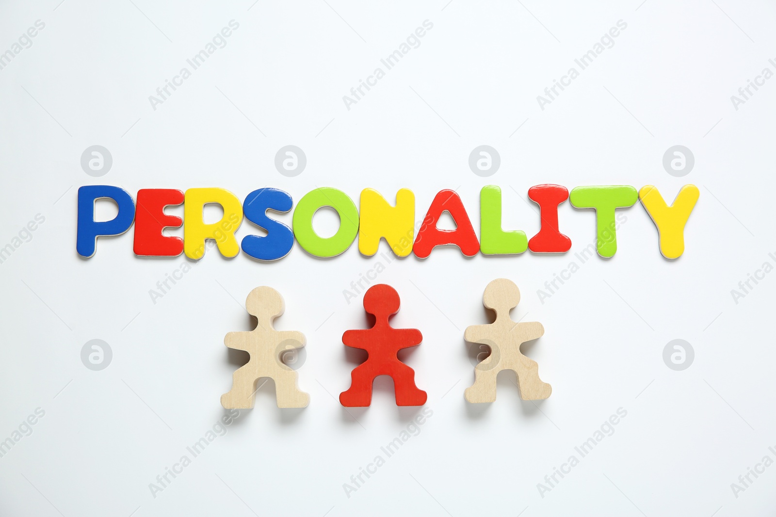 Photo of Word Personality made of colorful letters and human figures on white background, top view