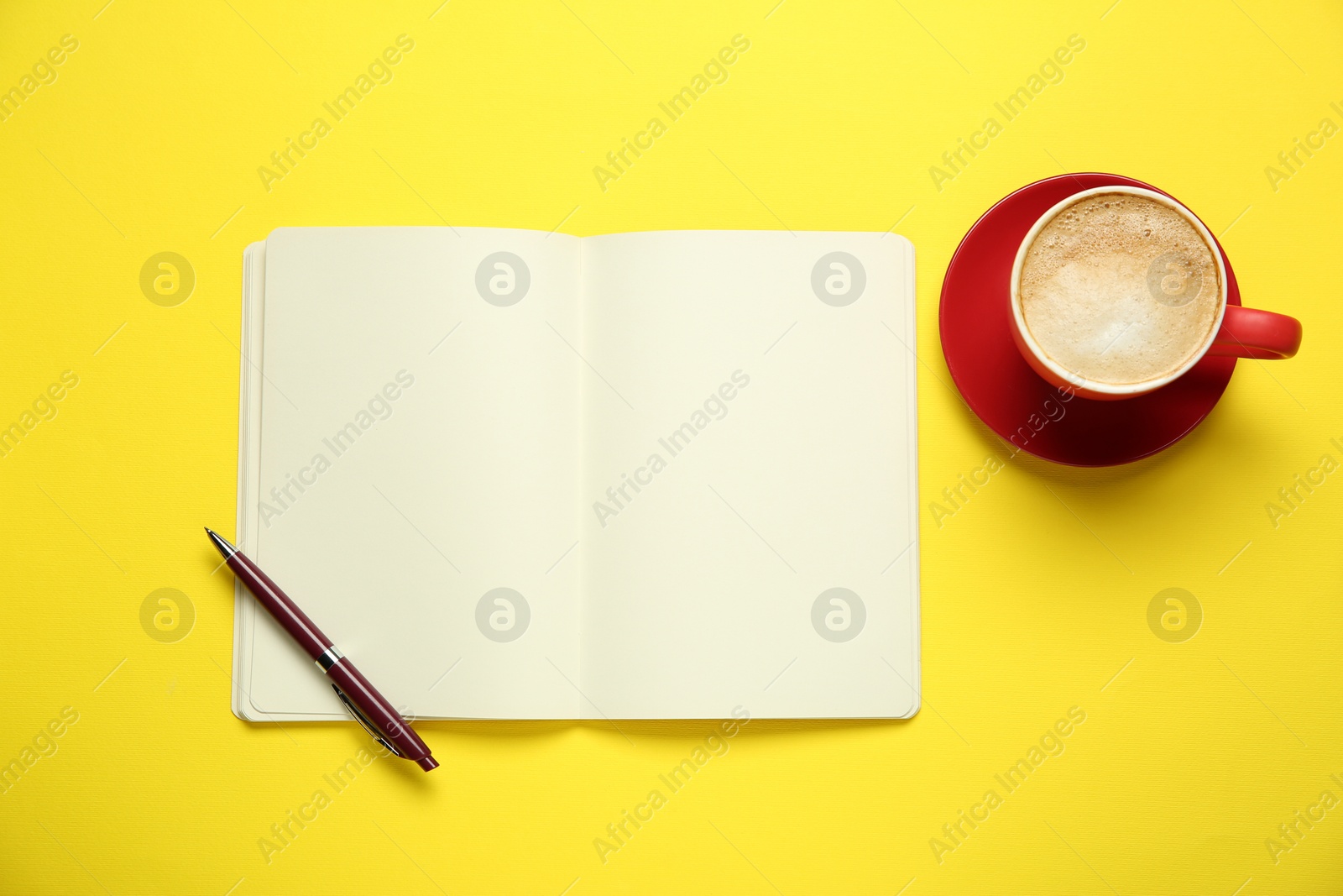 Photo of Blank notebook, coffee and pen on yellow background, flat lay. Space for text