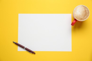 Photo of Blank paper, pen and coffee on yellow background, top view. Space for text