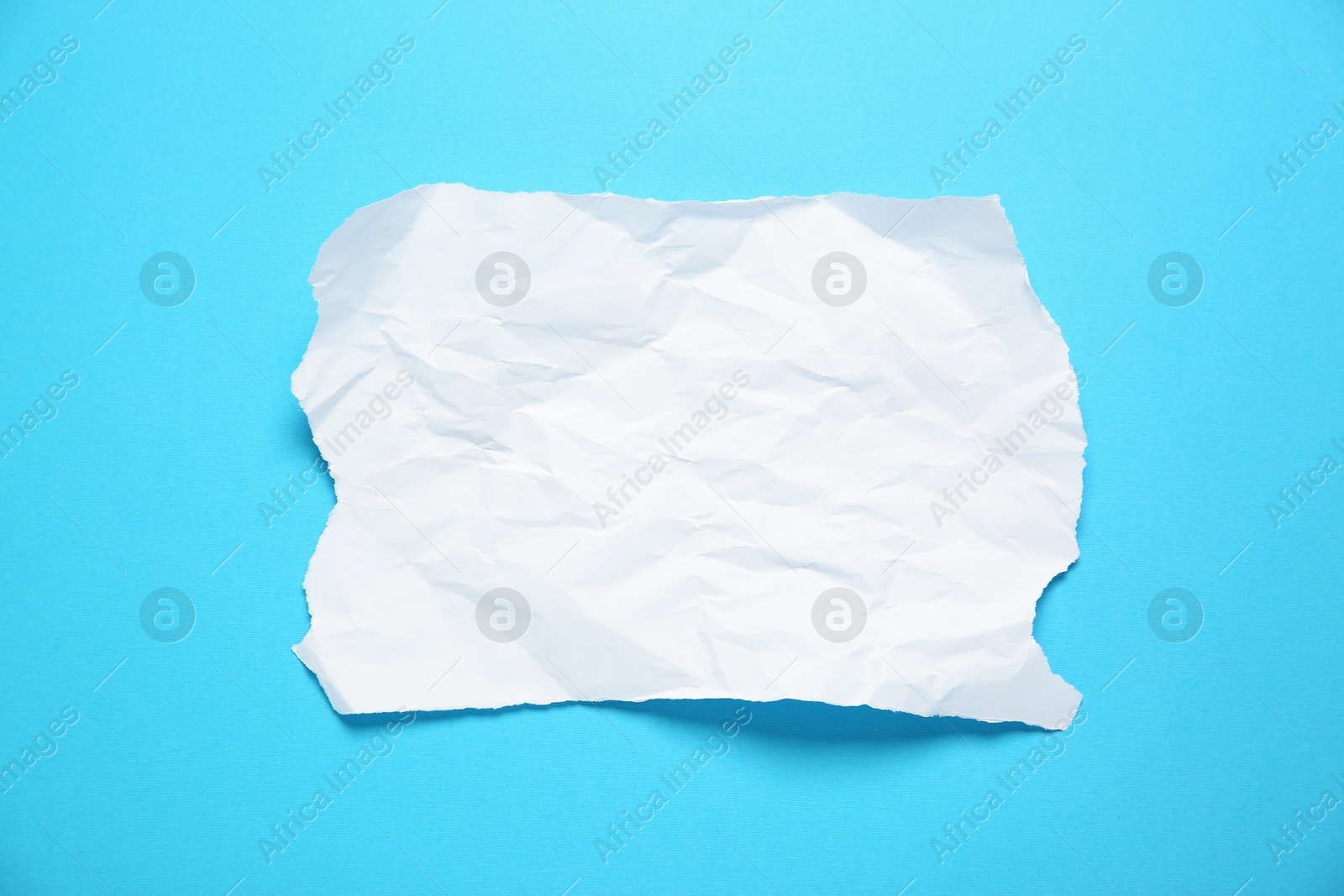 Photo of Blank note on light blue background, top view. Space for text