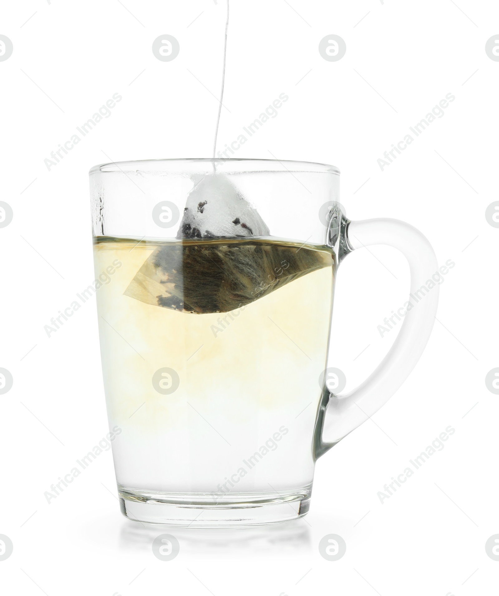 Photo of Brewing aromatic tea. Cup with teabag isolated on white