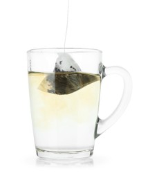 Photo of Brewing aromatic tea. Cup with teabag isolated on white