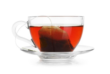 Photo of Brewing aromatic tea. Cup with teabag isolated on white