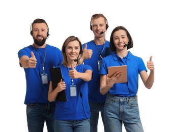 Photo of Technical support call center. Team of friendly operators showing thumbs up on white background