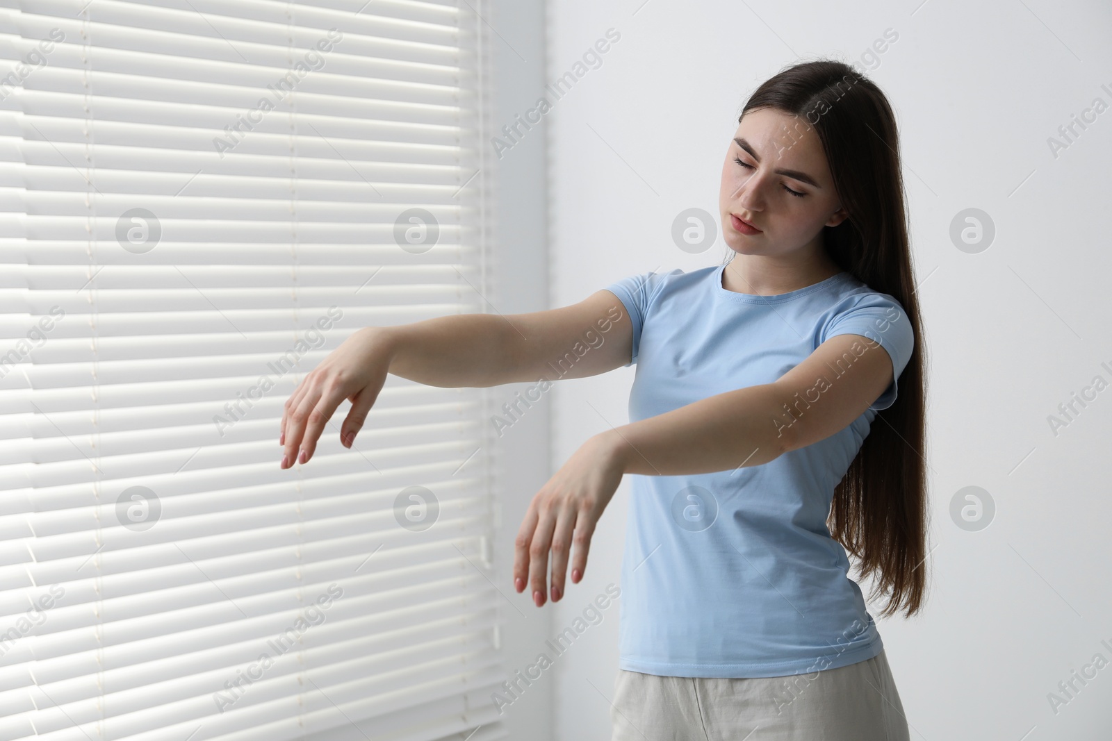 Photo of Young woman suffering from sleepwalking at home