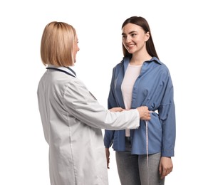 Weight loss. Nutritionist measuring patient's waist with tape on white background