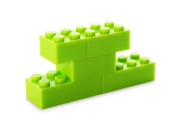 Photo of Construction toy. Figure made with building bricks isolated on white