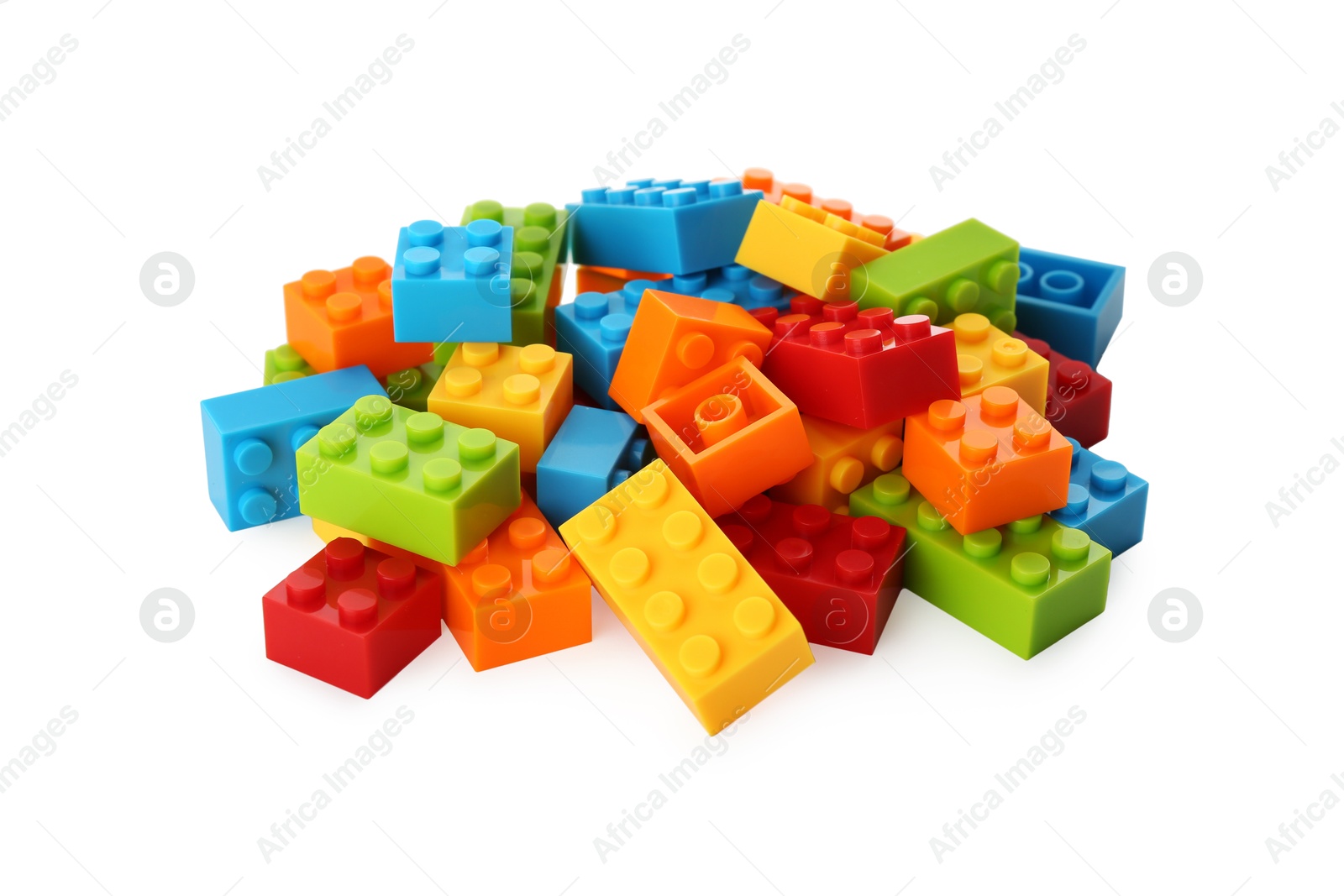 Photo of Construction toy. Pile of building bricks isolated on white