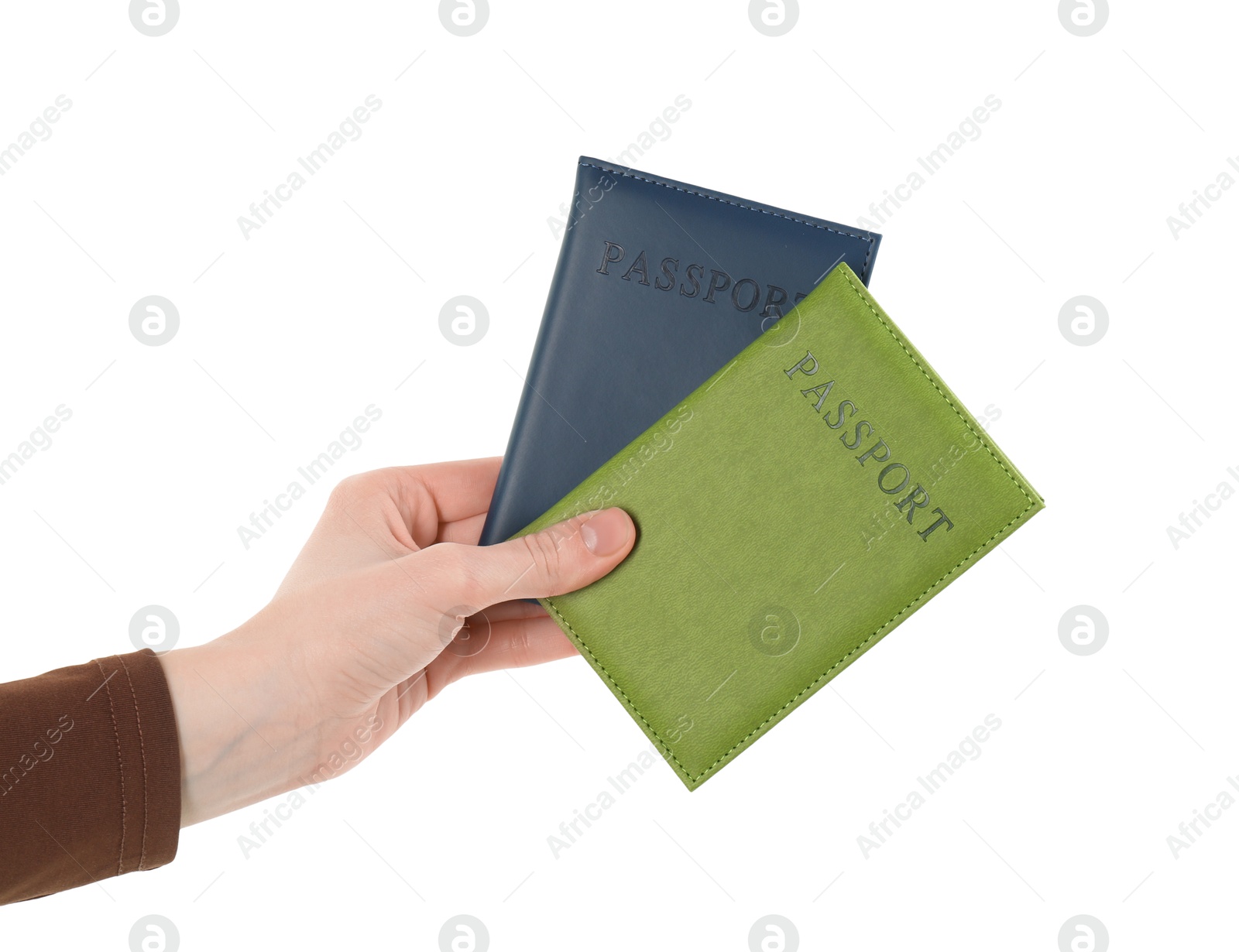 Photo of Woman holding passports in color covers on white background, closeup