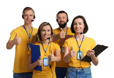 Photo of Technical support call center. Team of friendly operators showing thumbs up on white background