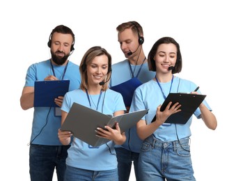 Technical support call center. Team of friendly operators working on white background