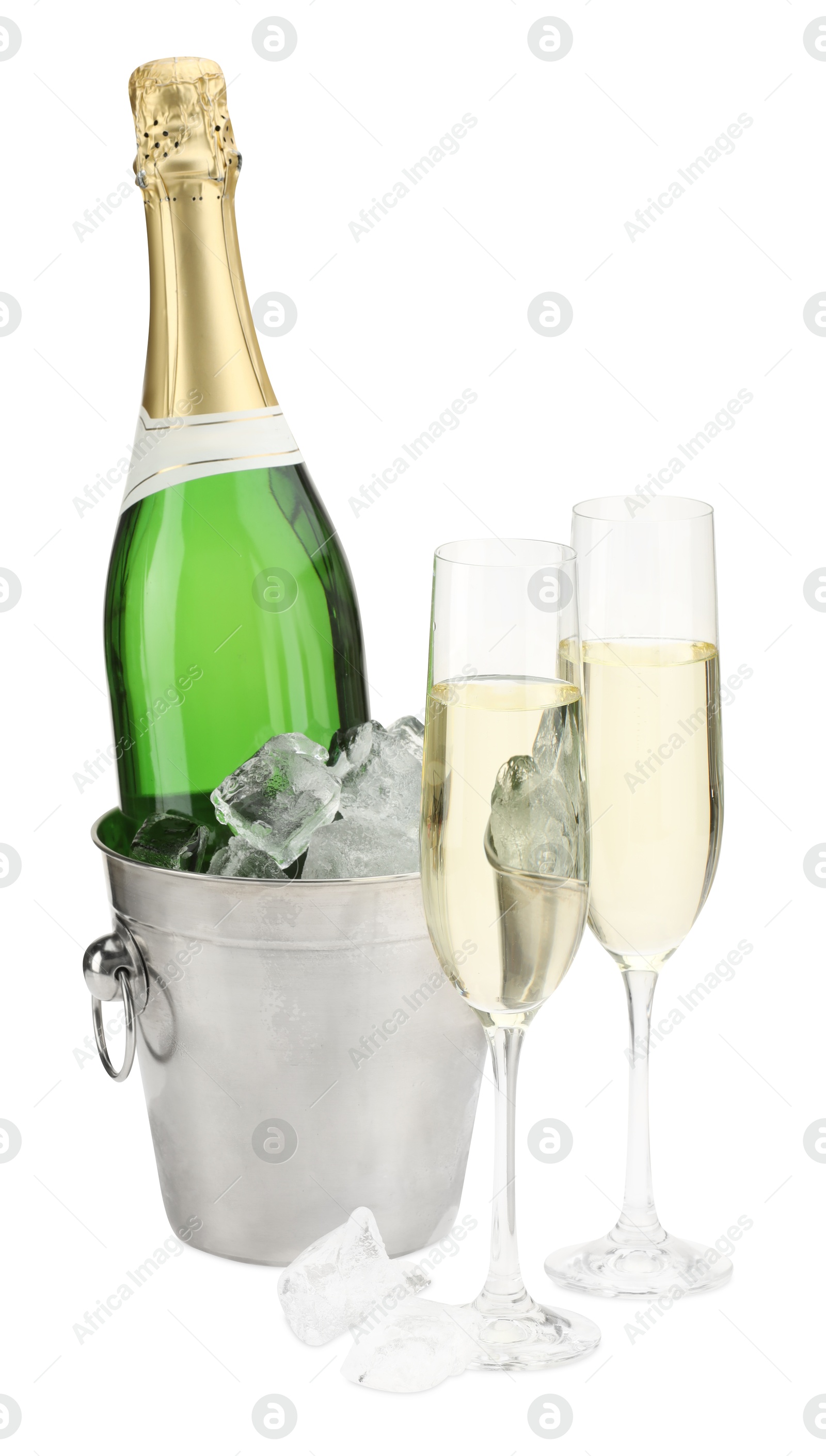 Photo of Champagne in glasses and ice bucket with bottle isolated on white