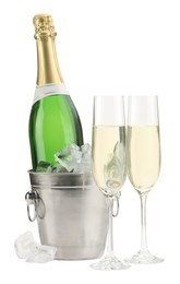 Champagne in glasses and ice bucket with bottle isolated on white