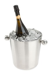 Photo of Bottle of champagne in ice bucket isolated on white